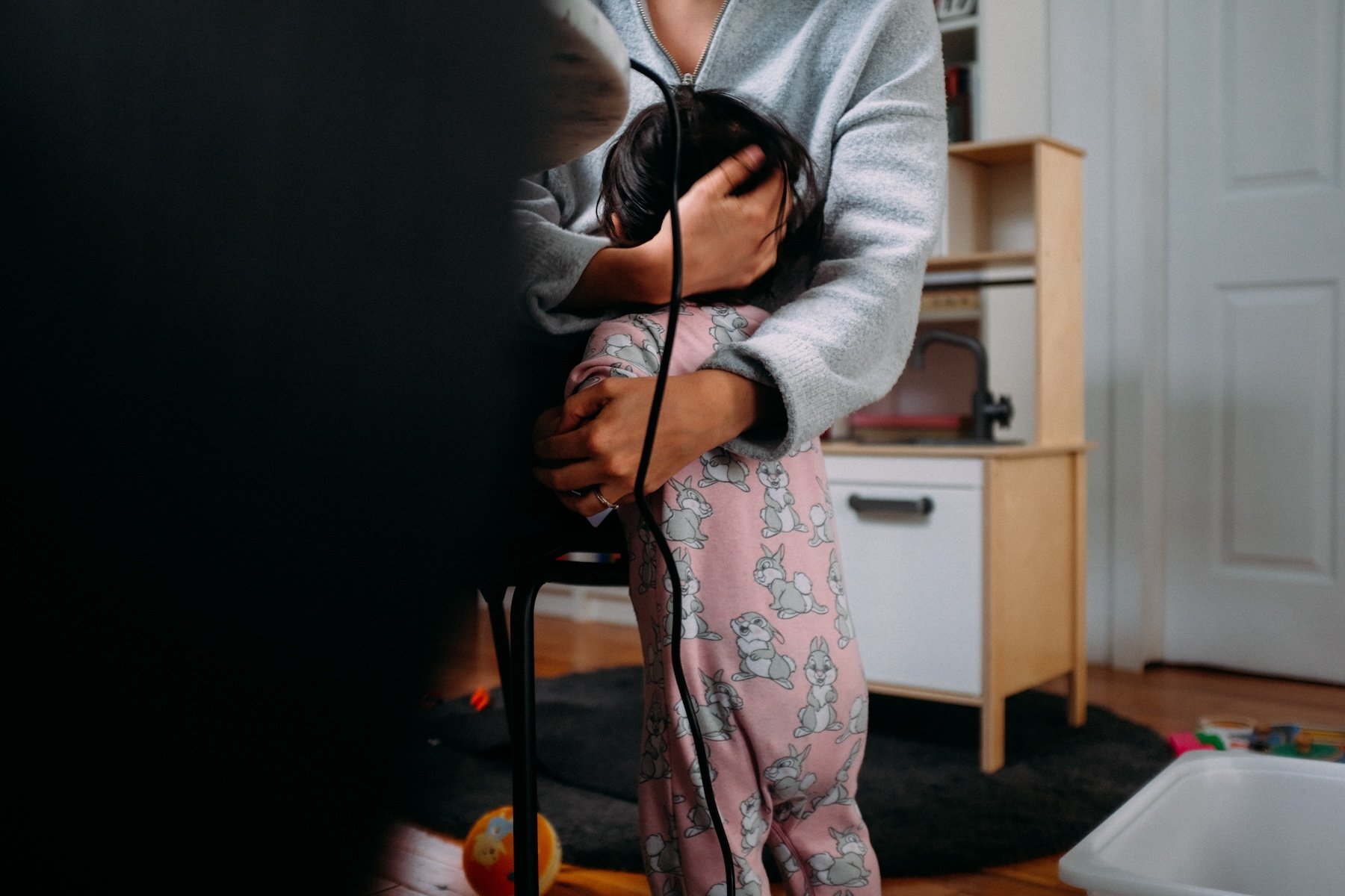 Baby hugging parent