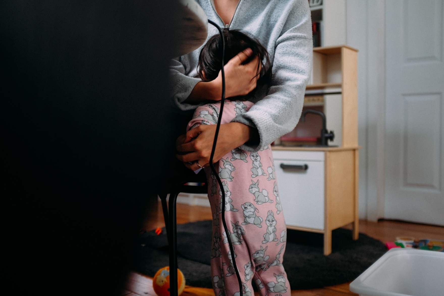 Baby hugging parent